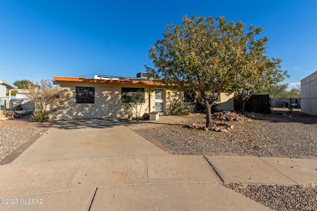 view of front of property featuring central AC unit