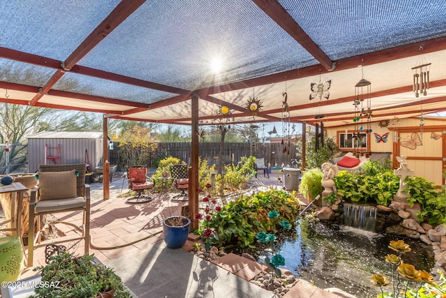 view of patio with a pergola and a storage unit