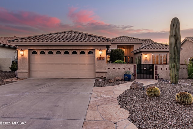 mediterranean / spanish-style house featuring a garage