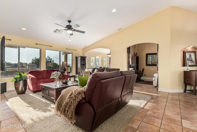 tiled living room with ceiling fan