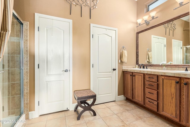 bathroom featuring vanity, tile patterned floors, and a shower with shower door