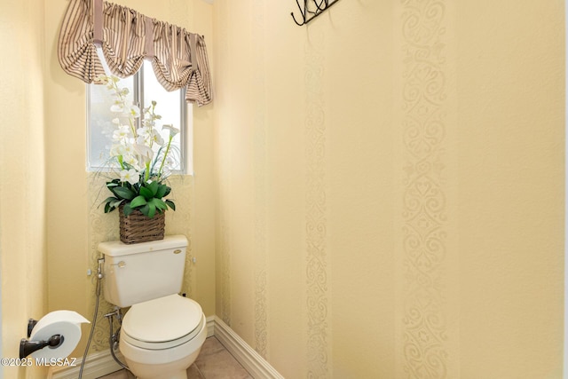 bathroom featuring tile patterned floors and toilet