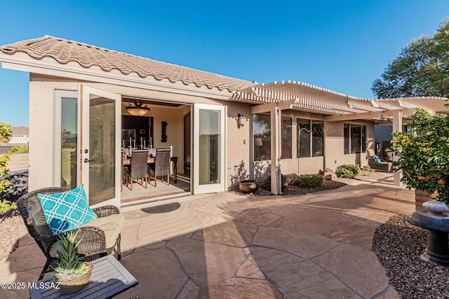 back of house with a patio