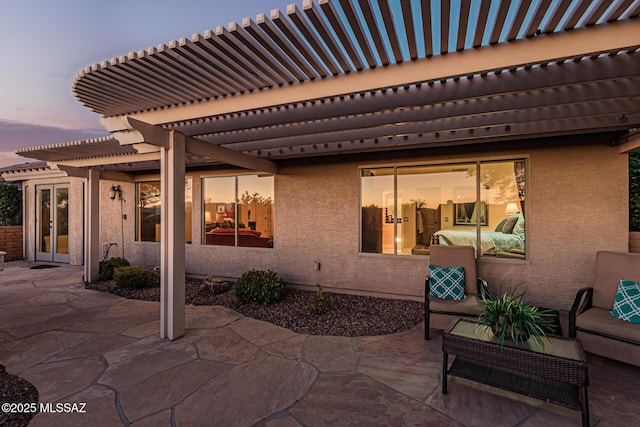 patio terrace at dusk with a pergola