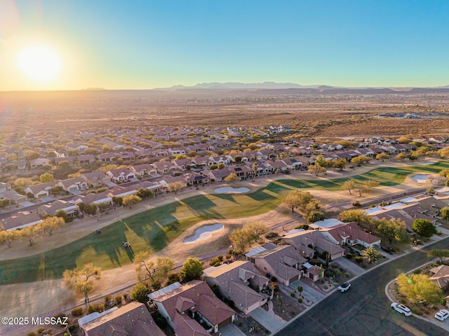 aerial view at dusk featuring a mountain view