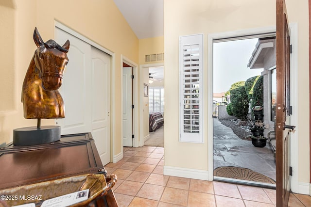 entrance foyer featuring ceiling fan and light tile patterned floors