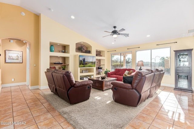 tiled living room with vaulted ceiling, built in features, and ceiling fan