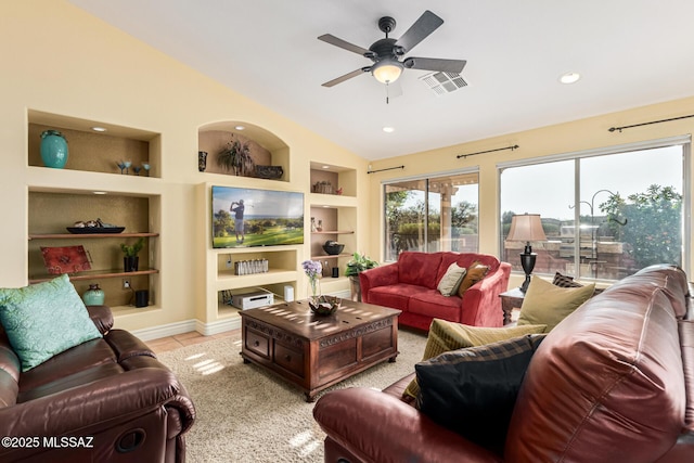 tiled living room featuring built in shelves, vaulted ceiling, and ceiling fan