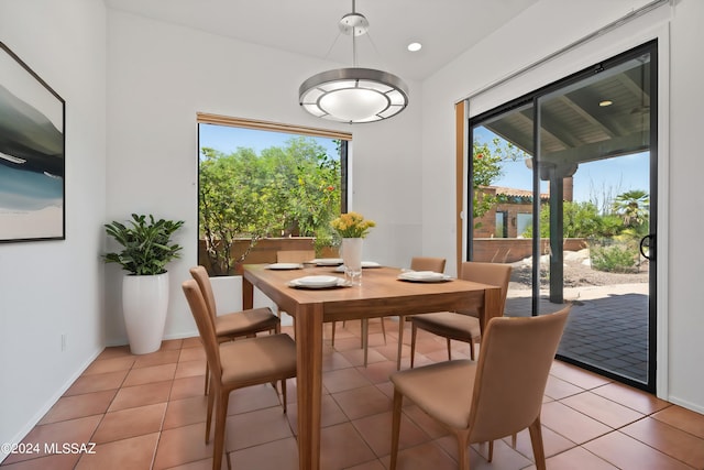 dining area with light tile patterned flooring