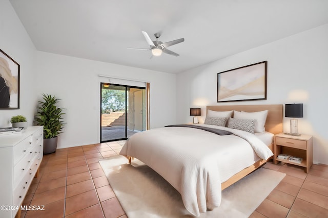 tiled bedroom with ceiling fan and access to outside