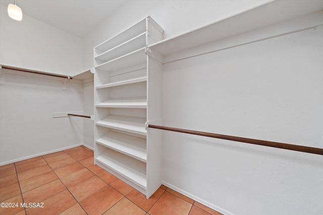 spacious closet with light tile patterned flooring