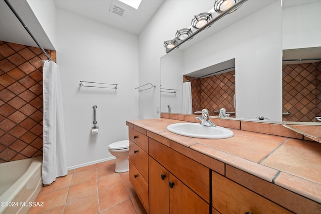 full bathroom featuring shower / bathtub combination with curtain, tile patterned flooring, vaulted ceiling, toilet, and vanity