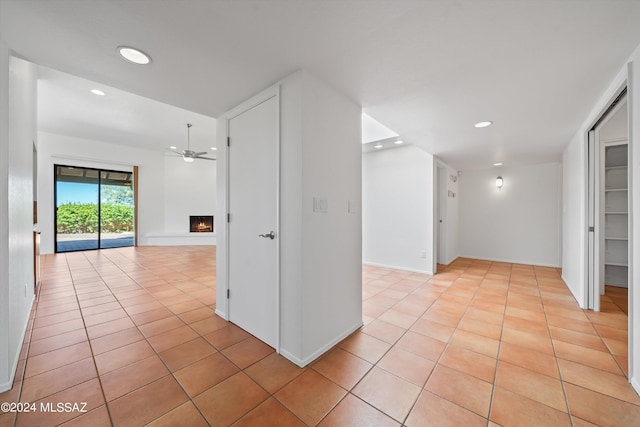 corridor featuring light tile patterned flooring