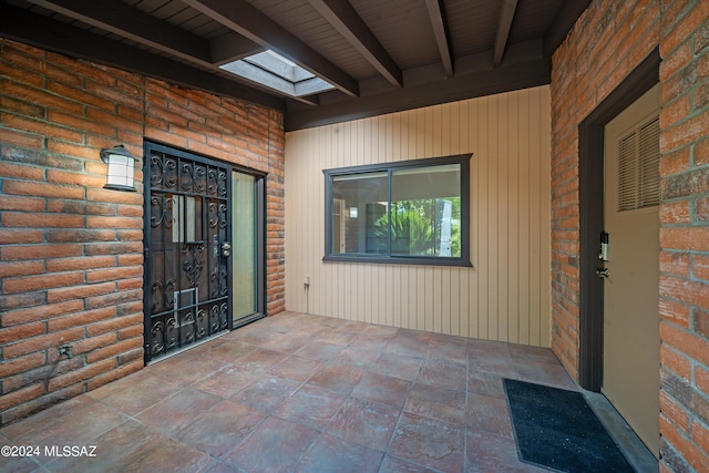 property entrance with a patio area