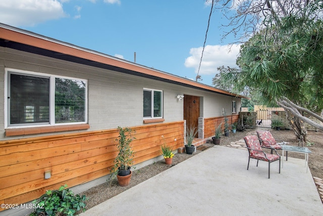 exterior space featuring a patio area and fence