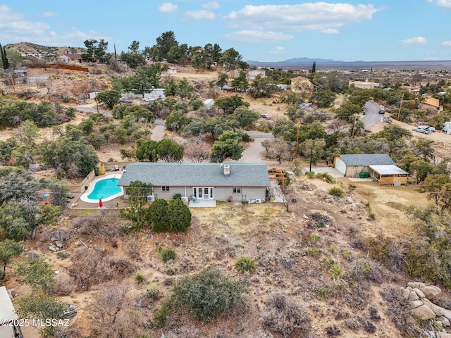 birds eye view of property featuring a mountain view