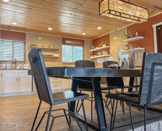 bar featuring recessed lighting, backsplash, wood ceiling, a sink, and light wood-type flooring