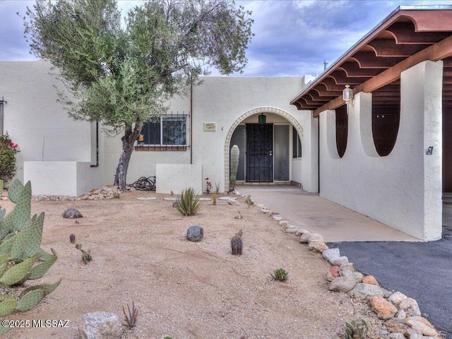 view of adobe home