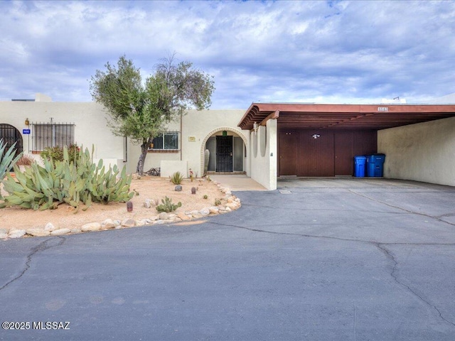 view of front of property with a carport