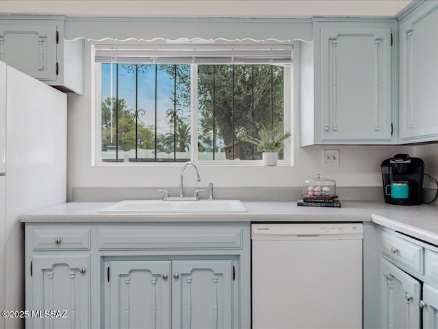 kitchen with white appliances and sink