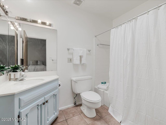 bathroom with toilet, a shower with shower curtain, vanity, and tile patterned floors