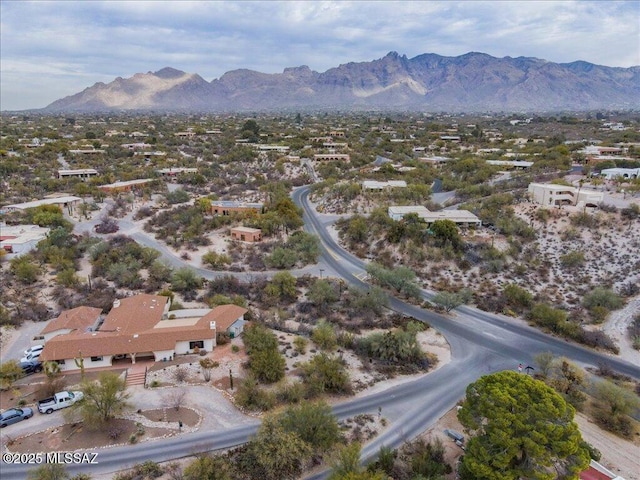 birds eye view of property with a mountain view