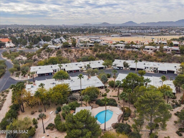 birds eye view of property featuring a mountain view