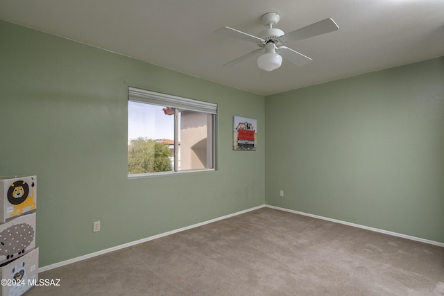 carpeted empty room with ceiling fan