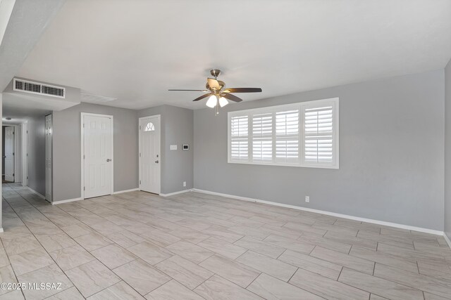 unfurnished room with ceiling fan