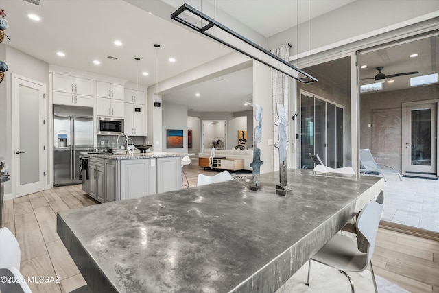 dining space featuring ceiling fan