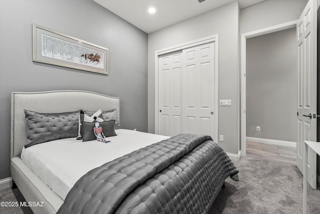 carpeted bedroom featuring a closet