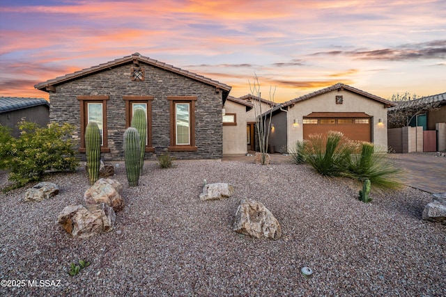 view of front of property with a garage