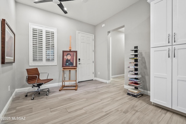 sitting room featuring ceiling fan