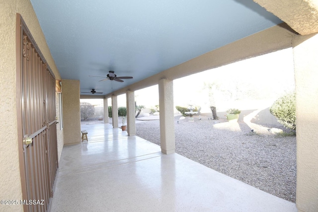 view of patio featuring ceiling fan