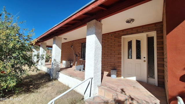 entrance to property featuring ac unit