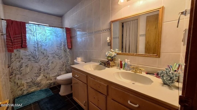 bathroom with vanity, tile patterned flooring, toilet, tile walls, and curtained shower