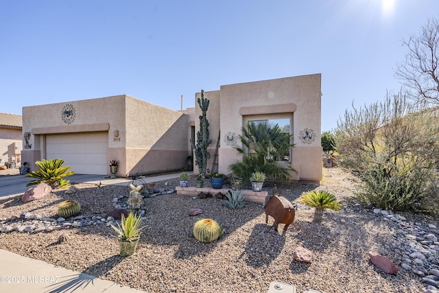 adobe home featuring a garage