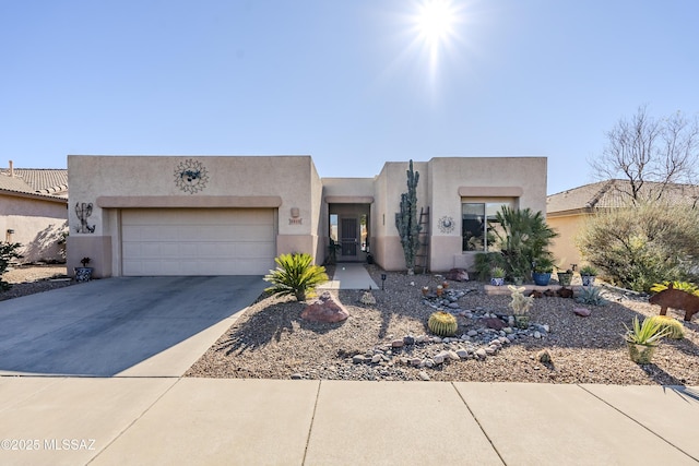 southwest-style home with a garage