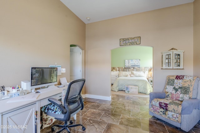 home office with high vaulted ceiling