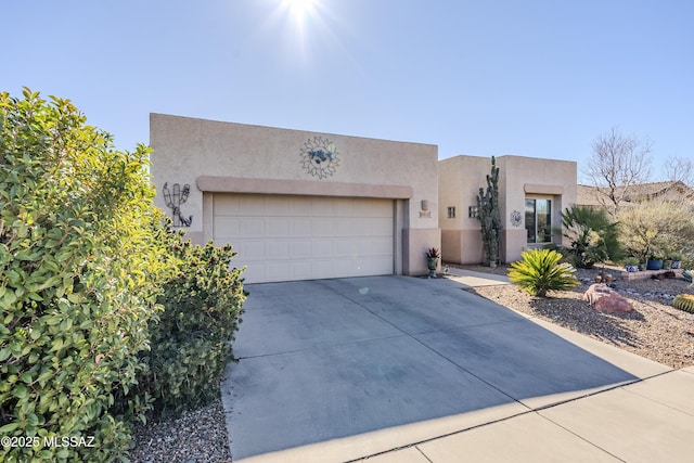 pueblo-style house with a garage