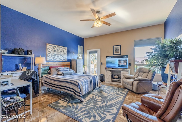 bedroom featuring ceiling fan and access to exterior