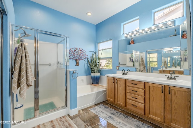 bathroom featuring independent shower and bath and vanity