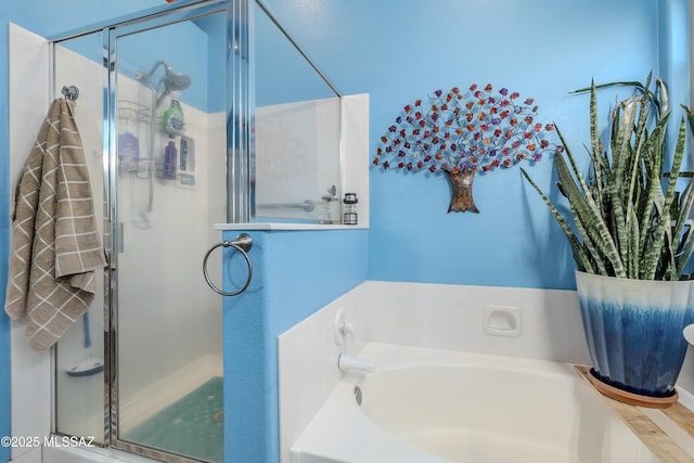 bathroom featuring separate shower and tub