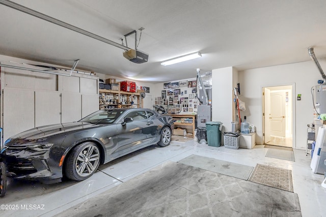 garage featuring a garage door opener and a workshop area