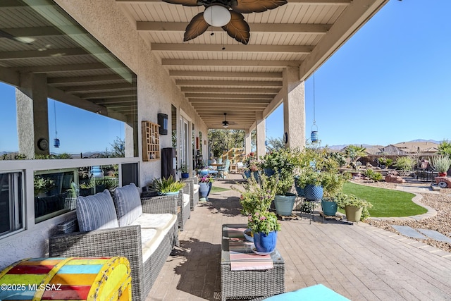 view of patio / terrace featuring an outdoor living space and ceiling fan