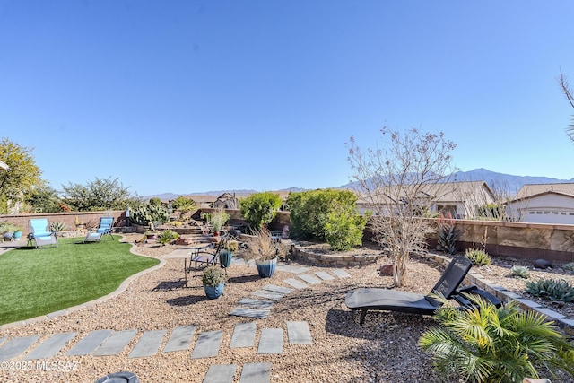 view of yard featuring a mountain view and a playground