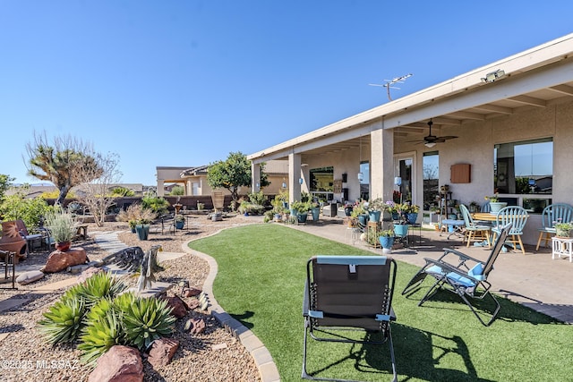 view of community featuring a patio area and a yard