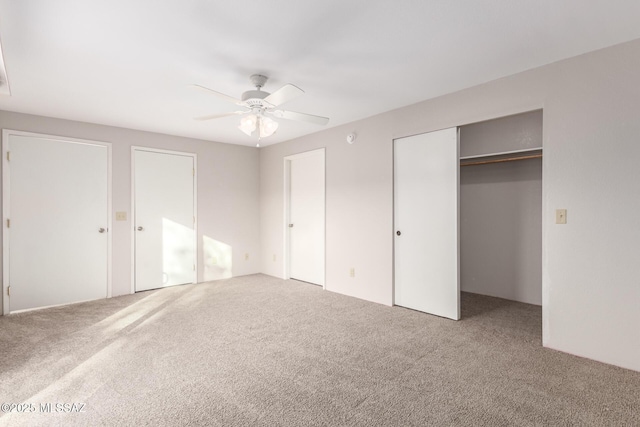 unfurnished bedroom featuring ceiling fan and carpet floors