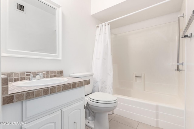 full bathroom featuring shower / bath combination with curtain, vanity, tile patterned floors, and toilet