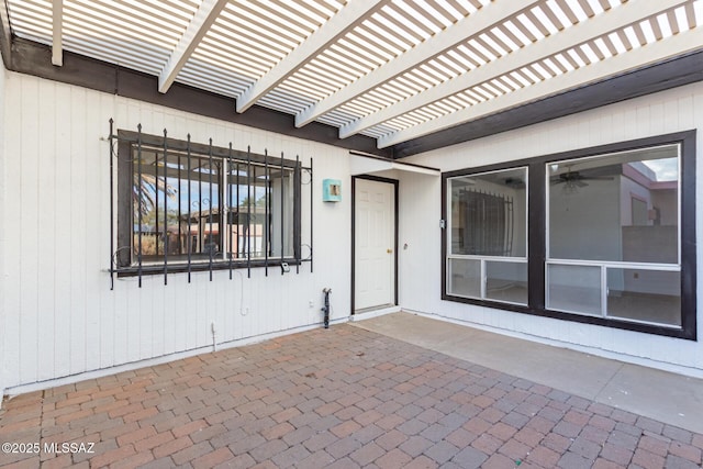 entrance to property with a pergola